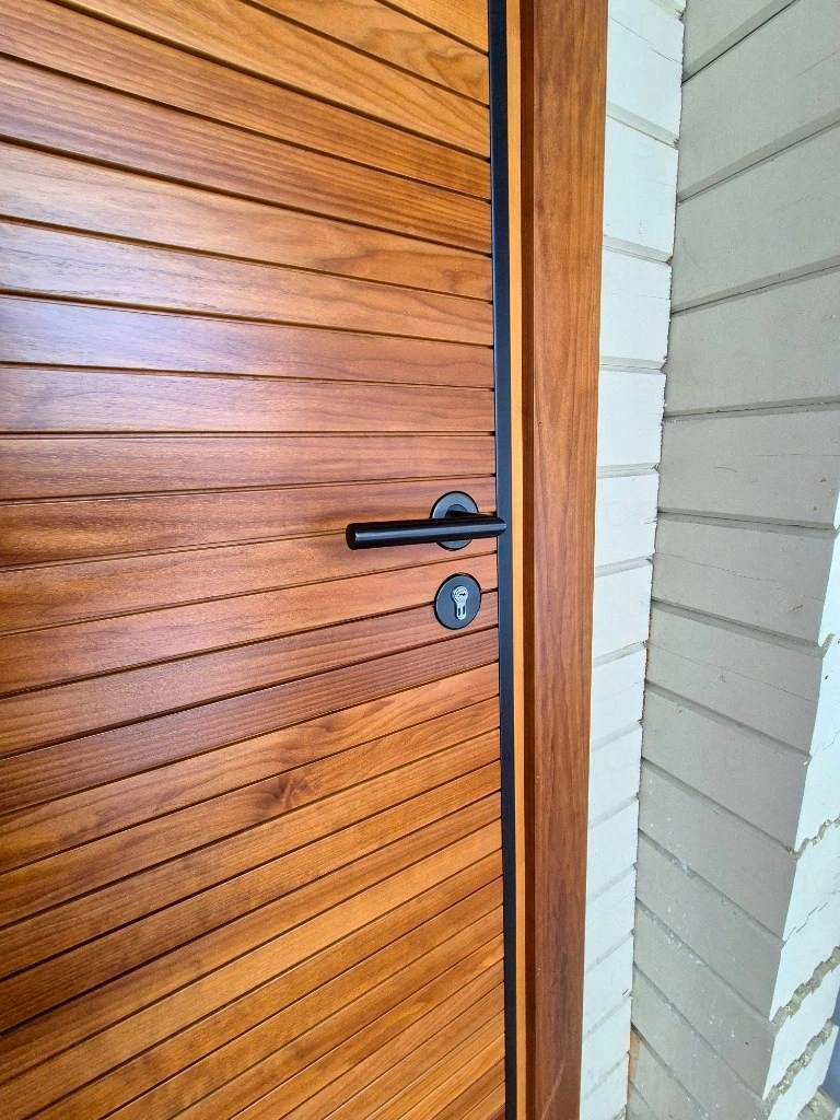 Фото 8 - Какую входную дверь выбрать в дом: плюсы термодерева Scandoors: производство и монтаж